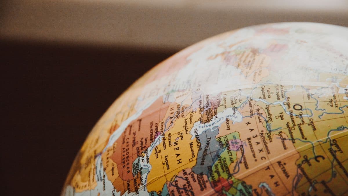 Globe showing Uzbekistan and partner-country region — symbol of double taxation treaties