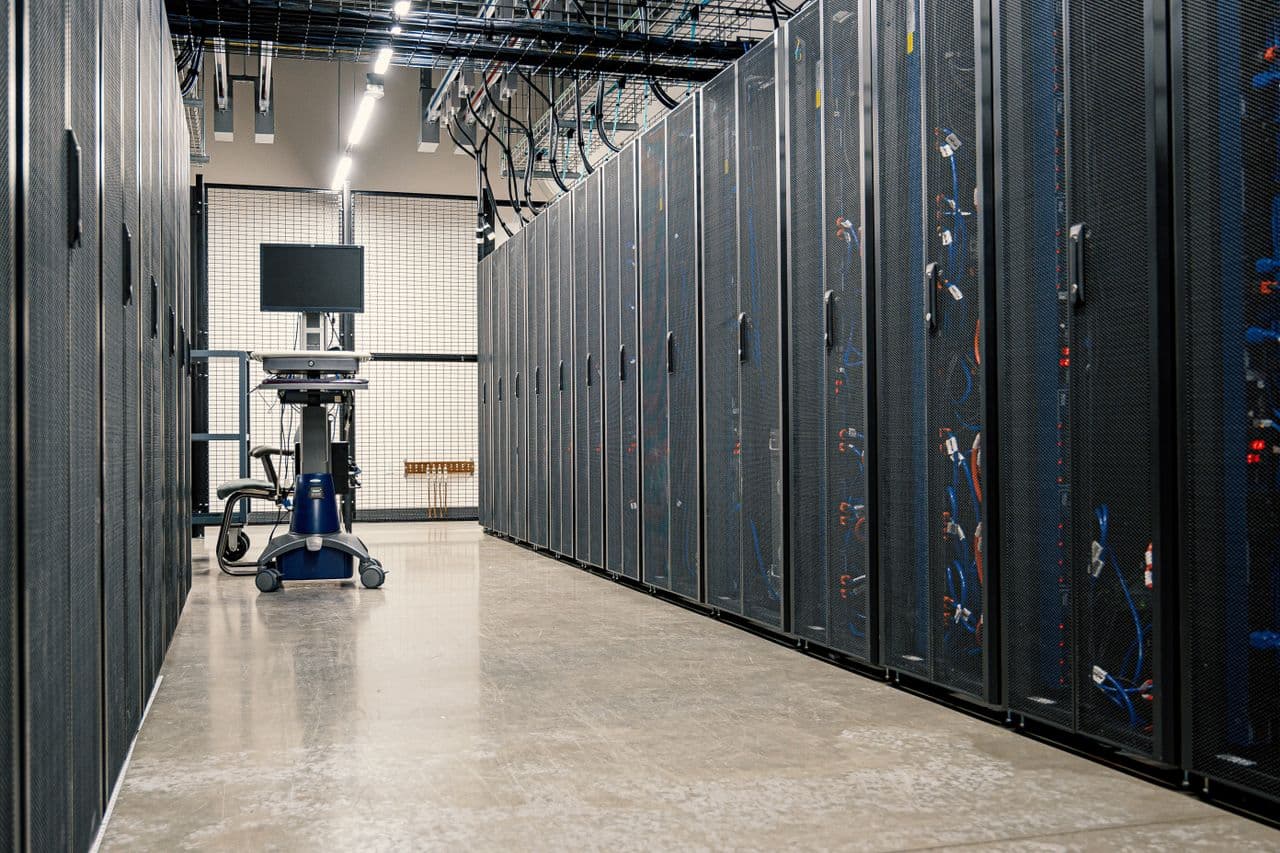 A data centre aisle with server racks